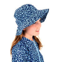 side view of girl wearing the Blueberry Swim Hat
    		