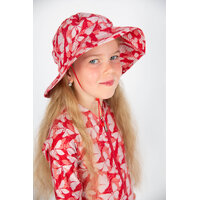 side view of a girl wearing the Butterfly Swim Hat
    		