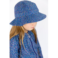 side view of girl wearing the Candy Sprinkles Swim Hat
    		