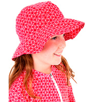 side view of girl wearing Pinwheel Red Hat
    		