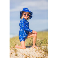 girl posing wearing the Blooms Swim Hat
    		