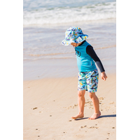 boy wearing the Surf Swim Hat at the beach
    		