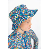 side view of girl wearing Ditsy Blue Swim Hat 